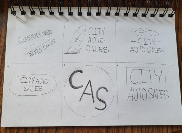 Paper with pencil
sketches of a variety of car logos