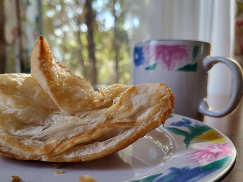 Close-up of a breakfast pastry resting on a table.